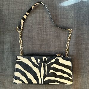 Zebra white and black shoulder bag with gold hardware